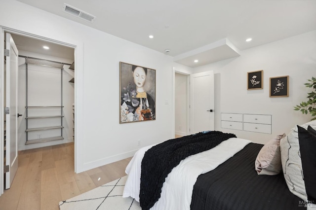 bedroom featuring a closet and light wood-type flooring