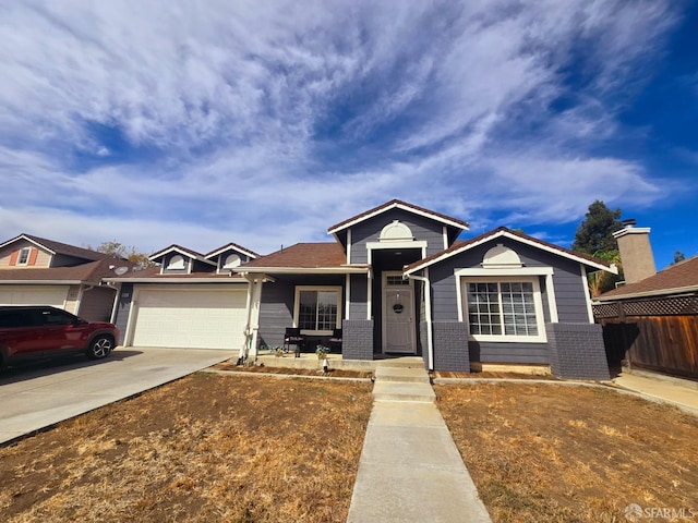 single story home featuring covered porch and a garage