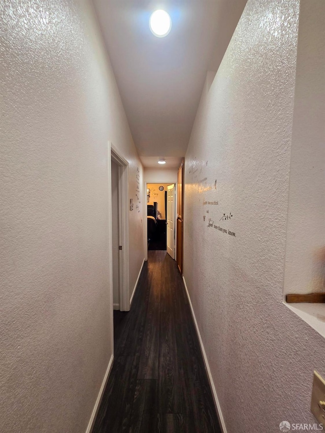 hall with dark hardwood / wood-style floors