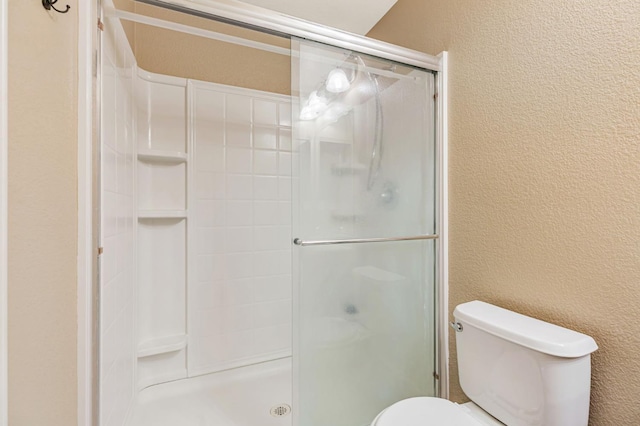 9877 Bluefin Way, Elk Grove, CA 95757 - bathroom featuring a textured wall and a stall shower