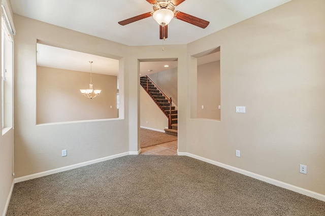 9877 Bluefin Way, Elk Grove, CA 95757 - unfurnished room featuring carpet, stairway, ceiling fan, and a chandelier
