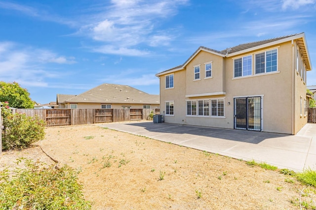 9877 Bluefin Way, Elk Grove, CA 95757 - rear view of house with stucco siding, a fenced backyard, and a patio area