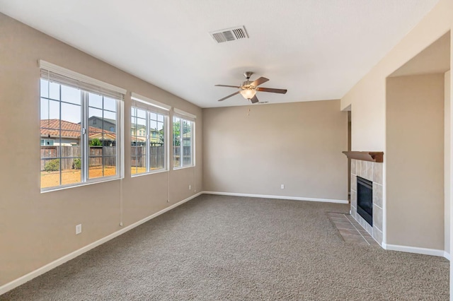 9877 Bluefin Way, Elk Grove, CA 95757 - unfurnished living room with ceiling fan, carpet, and a tiled fireplace