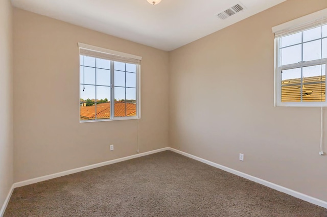 9877 Bluefin Way, Elk Grove, CA 95757 - spare room featuring healthy amount of natural light and carpet flooring