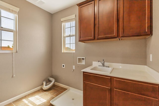 9877 Bluefin Way, Elk Grove, CA 95757 - laundry area with hookup for an electric dryer, washer hookup, cabinet space, and plenty of natural light