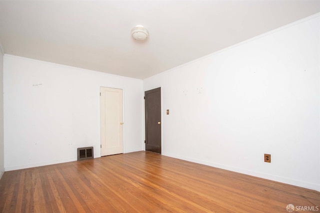 7520 Sunkist Dr, Oakland, CA 94605 - unfurnished room with wood finished floors, a smoke detector, and crown molding
