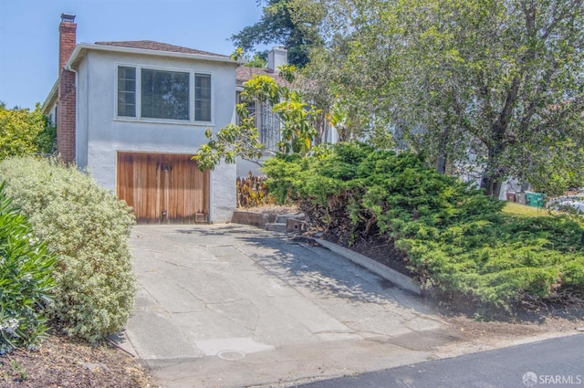 7520 Sunkist Dr, Oakland, CA 94605 - view of front of property with a chimney and stucco siding