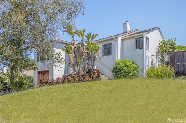 7520 Sunkist Dr, Oakland, CA 94605 - view of front facade with stucco siding and a chimney