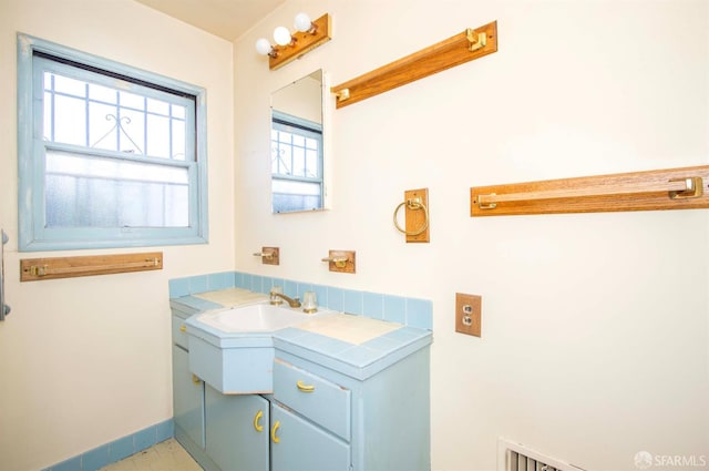 7520 Sunkist Dr, Oakland, CA 94605 - bathroom with vanity and baseboards