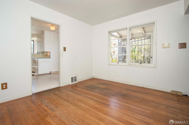 7520 Sunkist Dr, Oakland, CA 94605 - spare room featuring wood finished floors and baseboards