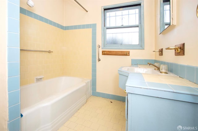 7520 Sunkist Dr, Oakland, CA 94605 - full bathroom featuring tile patterned flooring, vanity, and bathing tub / shower combination