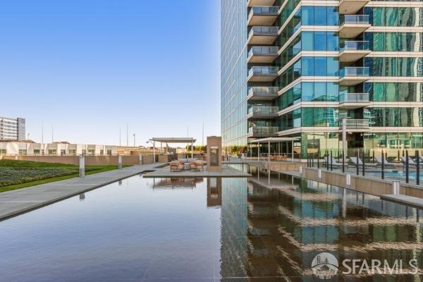 view of pool featuring a water view