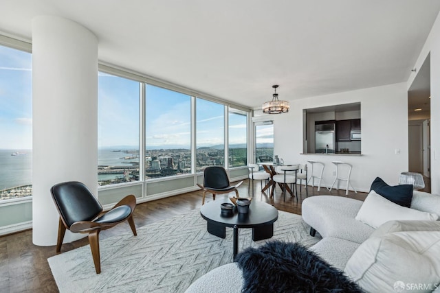 living room featuring a notable chandelier and wood finished floors