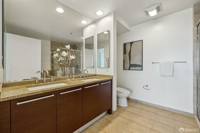 bathroom with a sink, visible vents, toilet, and a shower stall