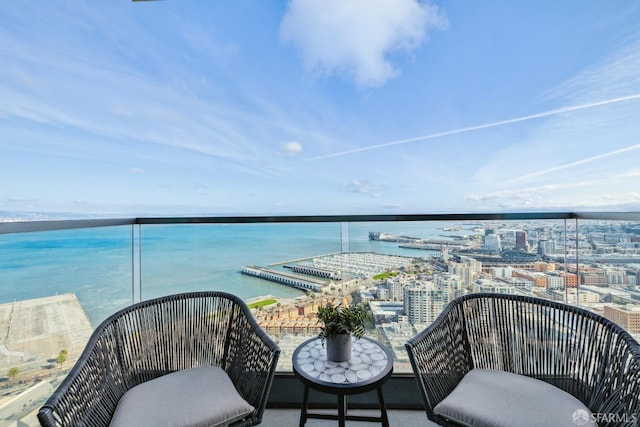 balcony featuring a view of city and a water view