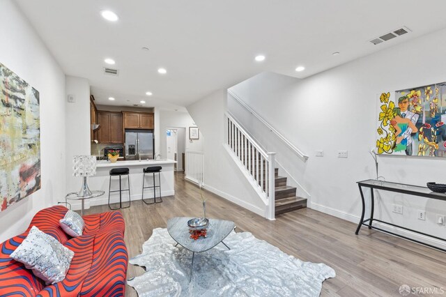 living room with light hardwood / wood-style floors