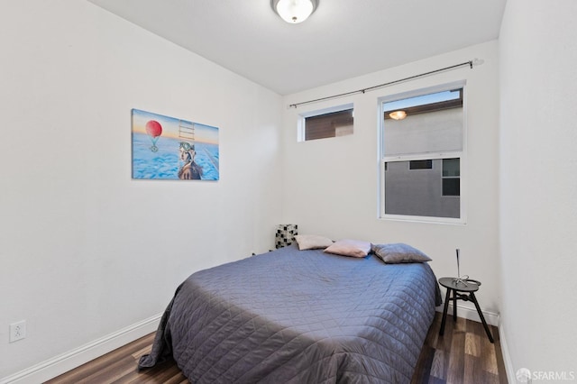 bedroom featuring dark wood-type flooring