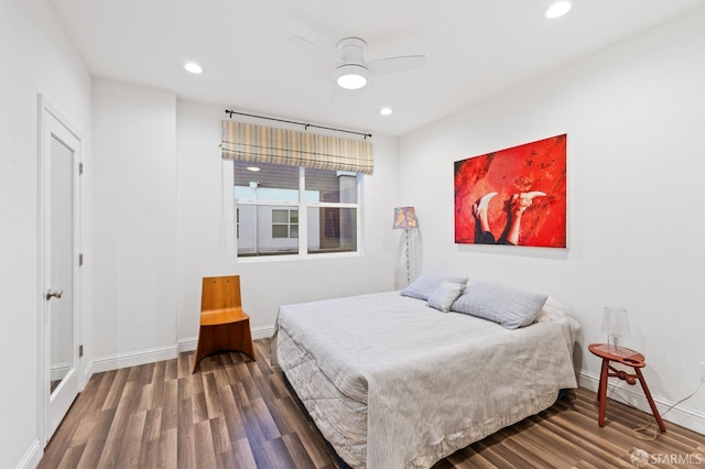 bedroom featuring hardwood / wood-style flooring and ceiling fan