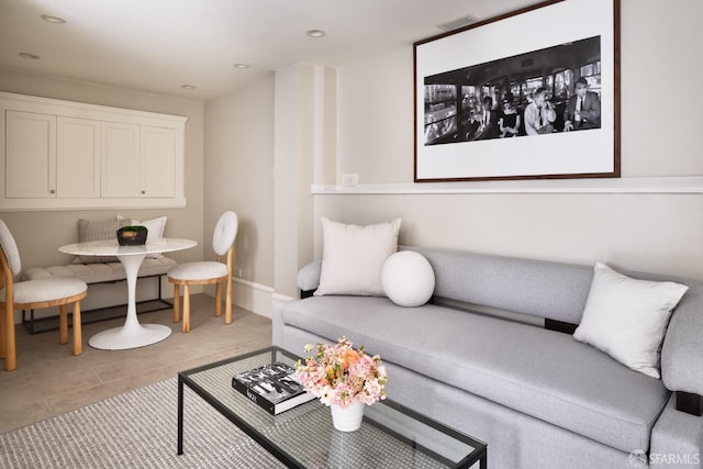 living area featuring recessed lighting, breakfast area, and tile patterned flooring