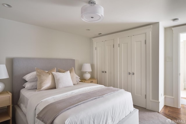 bedroom with two closets