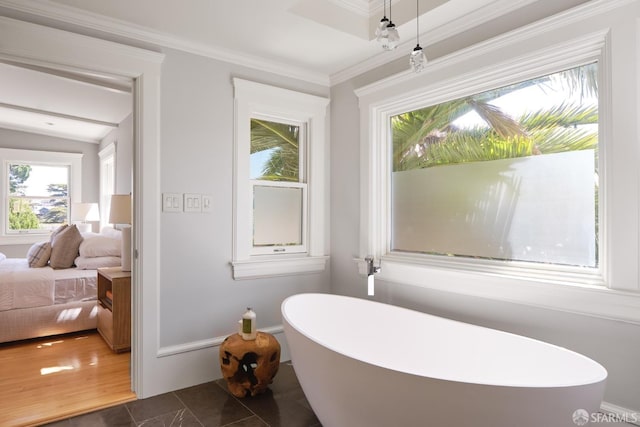 full bath featuring crown molding, a soaking tub, and ensuite bath