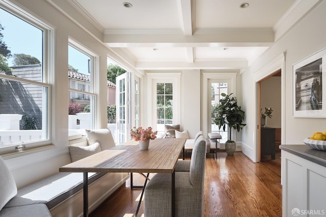 sunroom / solarium featuring beam ceiling and coffered ceiling