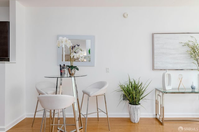 dining space featuring hardwood / wood-style flooring