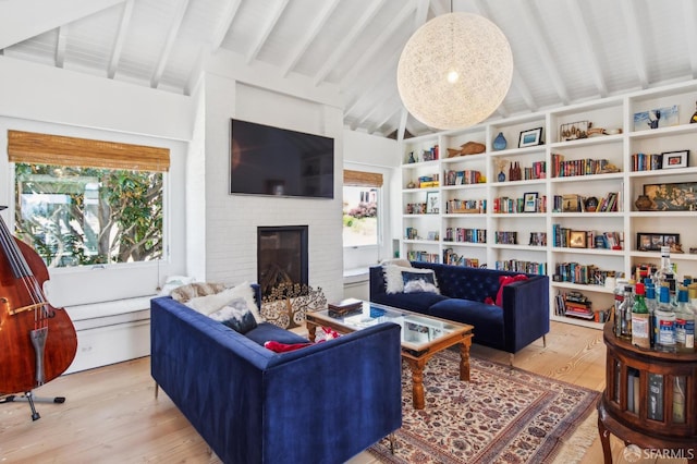 1507 Noe St, San Francisco, CA 94131 - living area with wood finished floors, a brick fireplace, and built in features
