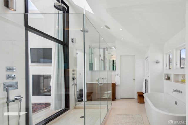 1507 Noe St, San Francisco, CA 94131 - bathroom with lofted ceiling, a shower stall, a freestanding bath, a skylight, and tile patterned flooring