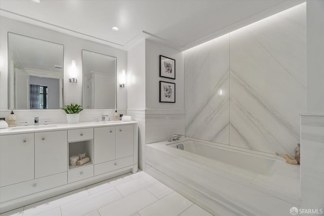 bathroom featuring vanity and a tub