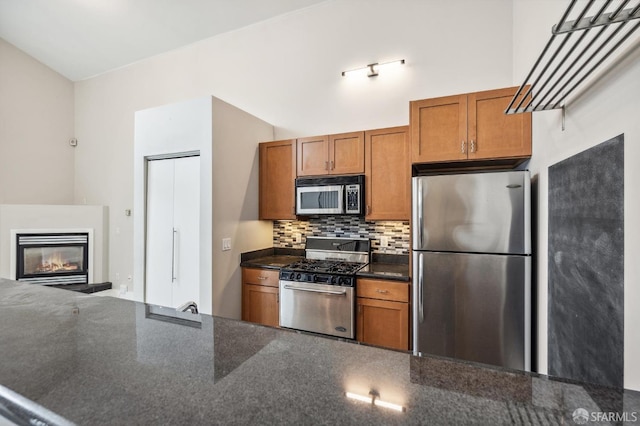 kitchen featuring stainless steel appliances and backsplash