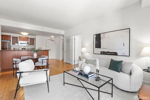 living room with light hardwood / wood-style floors