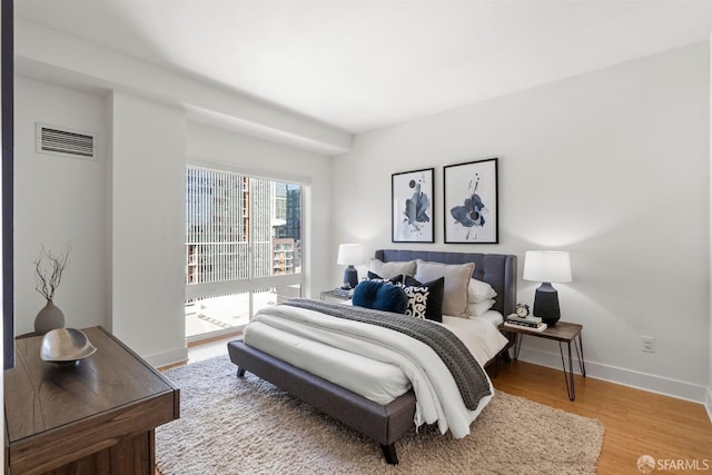 bedroom featuring wood-type flooring