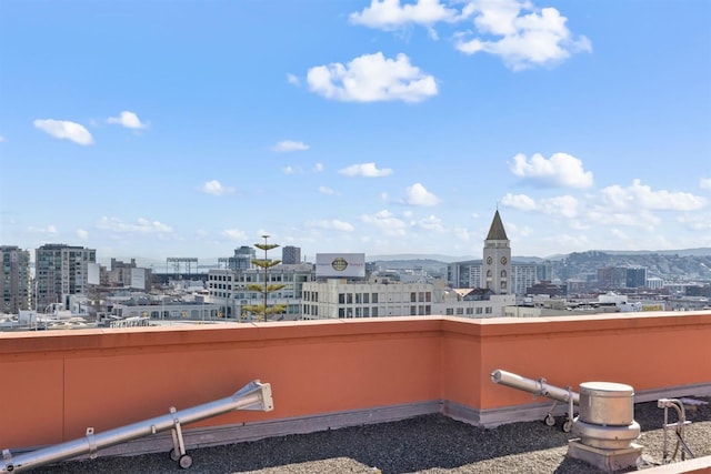 view of patio with a balcony and a mountain view