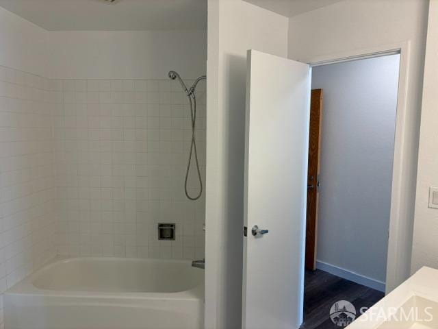 bathroom with shower / tub combination and vanity