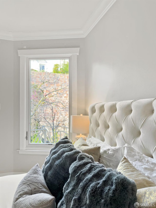 bedroom with crown molding