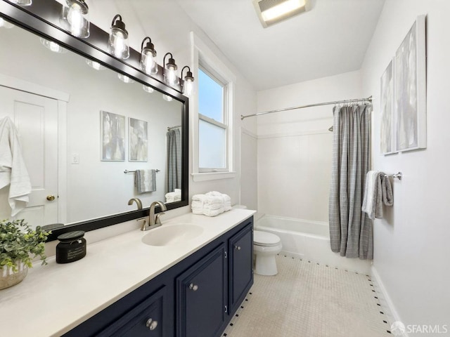 full bathroom featuring vanity, tile patterned floors, toilet, and shower / bath combo