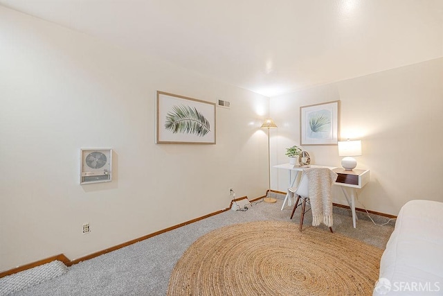 sitting room with visible vents, baseboards, and carpet