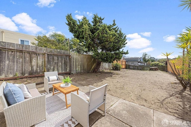 view of patio featuring an outdoor hangout area and a fenced backyard