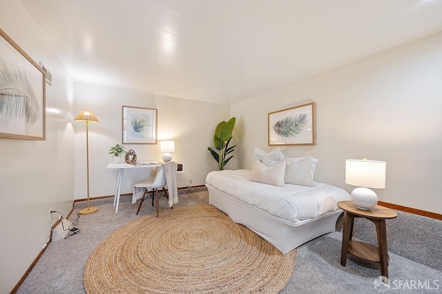 carpeted bedroom featuring baseboards