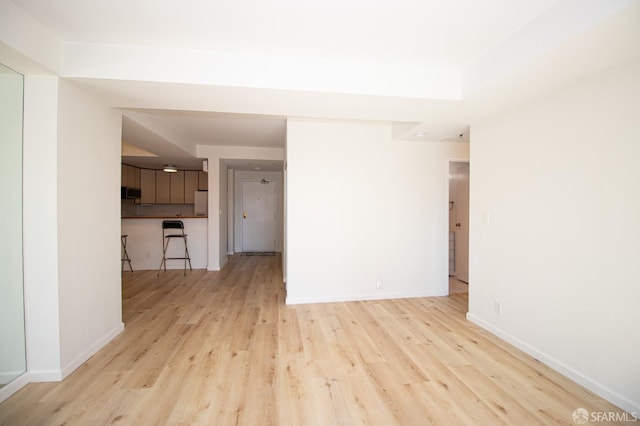 601 Van Ness Ave Unit 712, San Francisco, CA 94102 - unfurnished living room featuring light wood-style flooring and baseboards