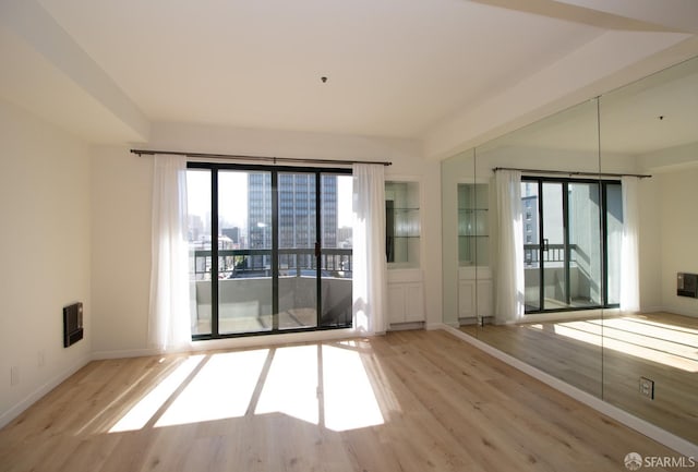 601 Van Ness Ave Unit 712, San Francisco, CA 94102 - spare room featuring wood finished floors and healthy amount of natural light