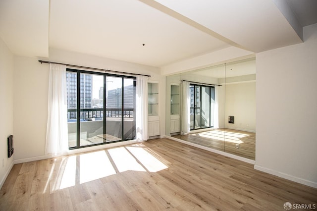 601 Van Ness Ave Unit 712, San Francisco, CA 94102 - spare room with wood finished floors and baseboards