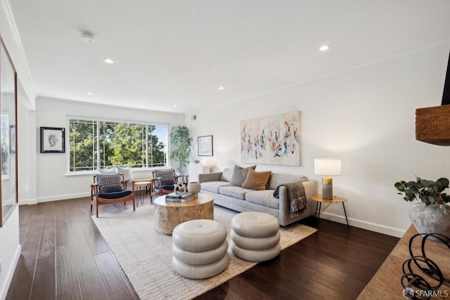 living room with ornamental molding and dark hardwood / wood-style flooring