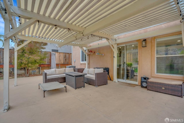 view of patio / terrace with fence, outdoor lounge area, and a pergola