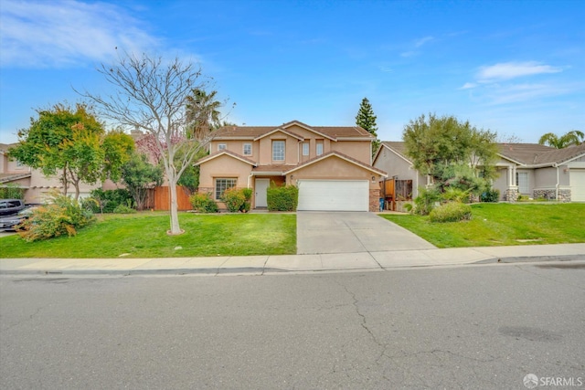 traditional-style house with a front yard, concrete driveway, an attached garage, and stucco siding