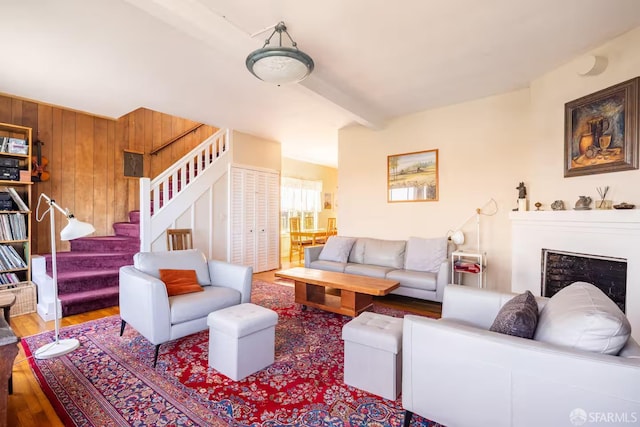 70 Laidley St, San Francisco, CA 94131 - living area with stairs, wood walls, wood finished floors, beamed ceiling, and a fireplace