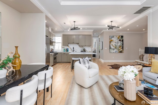 2675 Sutter St, San Francisco, CA 94115 - living area featuring a chandelier, light wood-type flooring, recessed lighting, and ornamental molding