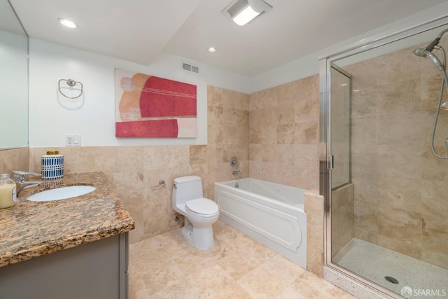 2675 Sutter St, San Francisco, CA 94115 - full bathroom featuring tile walls, vanity, a bath, a shower stall, and recessed lighting