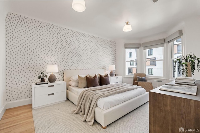 bedroom with light hardwood / wood-style floors